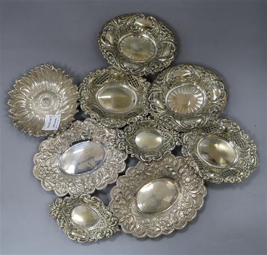 Three white metal trinket dishes, one modelled as a sunflower and six assorted plated trinket dishes